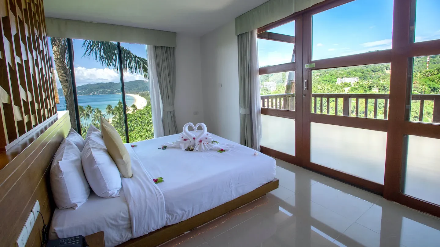 Romantic honeymoon suite with swan towel decoration, overlooking Karon Beach and sea views at Peach Blossom Resort Phuket
